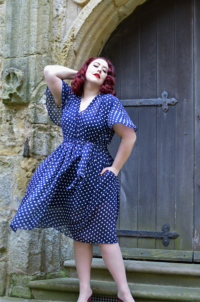 plus sized pinup fit review by Miss Amy May of the Navy Polka Dot Flutter Sleeve Claudia dress by Alexandra King for Deadly is the Female