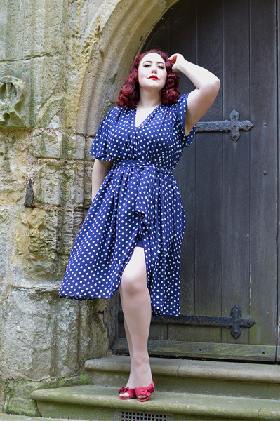 plus sized pinup fit review by Miss Amy May of the Navy Polka Dot Flutter Sleeve Claudia dress by Alexandra King for Deadly is the Female