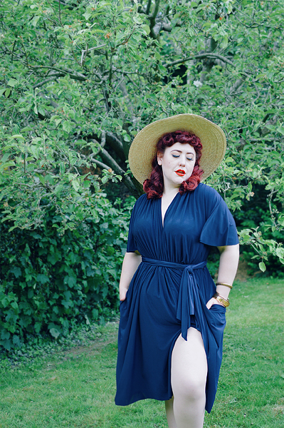 Plus size pinup Miss Amy May reviews the Navy Flutter Sleeve Claudia dress by Alexandra King for Deadly is the Female, including fit and size details