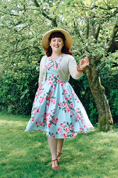 Plus sized pinup Miss Amy May writes a fit and size review of the Blue Vintage Rose Hourglass swing dress gifted by The Pretty Dress Company