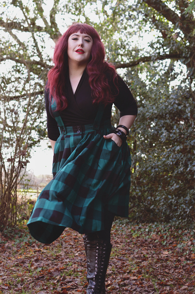 Plus size pinup Miss Amy May models the Green Teen Spirit Pinafore skirt gifted by Hell Bunny for a fit and sizing review