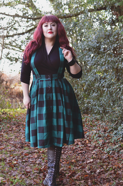 Plus size pinup Miss Amy May models the Green Teen Spirit Pinafore skirt gifted by Hell Bunny for a fit and sizing review