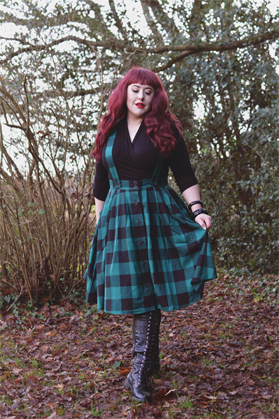 Plus size pinup Miss Amy May models the Green Teen Spirit Pinafore skirt gifted by Hell Bunny for a fit and sizing review