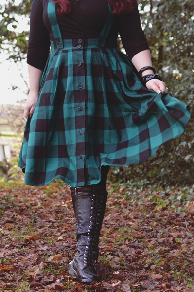 Plus size pinup Miss Amy May models the Green Teen Spirit Pinafore skirt gifted by Hell Bunny for a fit and sizing review
