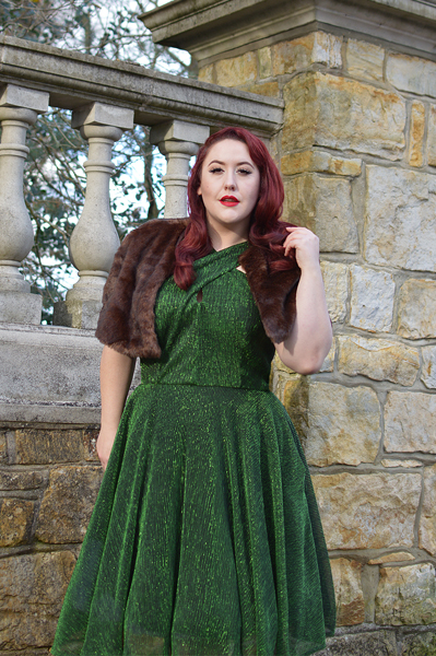 Plus size pinup Miss Amy May modelling the Emerald Metallic Ribbed Valentina swing dress gifted by Unique Vintage for a fit and sizing review