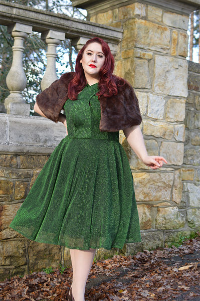 Plus size pinup Miss Amy May modelling the Emerald Metallic Ribbed Valentina swing dress gifted by Unique Vintage for a fit and sizing review