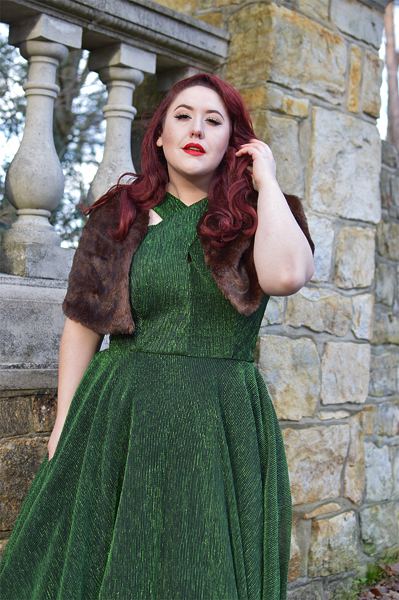 Plus size pinup Miss Amy May modelling the Emerald Metallic Ribbed Valentina swing dress gifted by Unique Vintage for a fit and sizing review