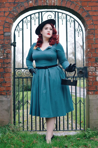 Plus size pinup Miss Amy May models the teal Parinita-Sento dress gifted by Miss Candyfloss for a fit and size review