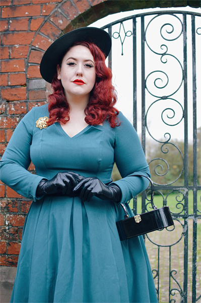 Plus size pinup Miss Amy May models the teal Parinita-Sento dress gifted by Miss Candyfloss for a fit and size review