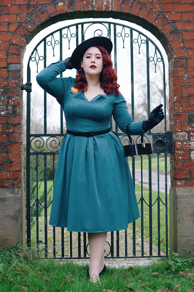 Plus size pinup Miss Amy May models the teal Parinita-Sento dress gifted by Miss Candyfloss for a fit and size review