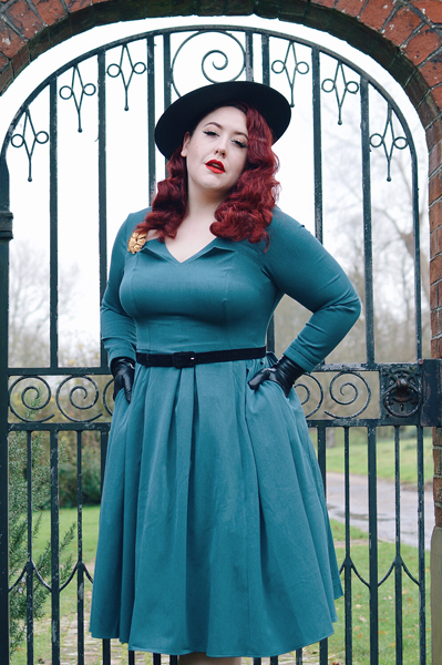 Plus size pinup Miss Amy May models the teal Parinita-Sento dress gifted by Miss Candyfloss for a fit and size review