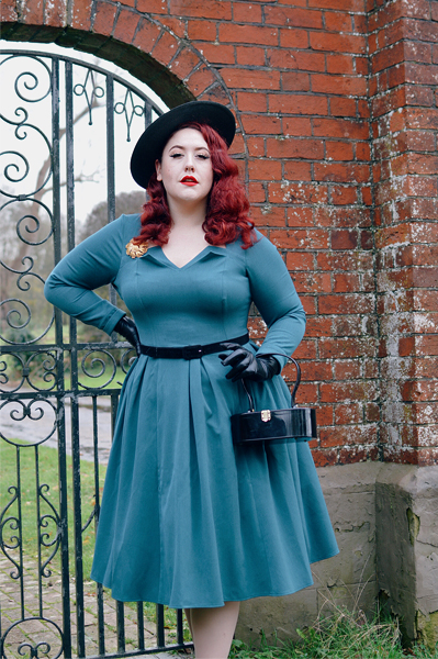 Plus size pinup Miss Amy May models the teal Parinita-Sento dress gifted by Miss Candyfloss for a fit and size review