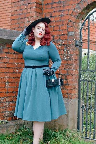 Plus size pinup Miss Amy May models the teal Parinita-Sento dress gifted by Miss Candyfloss for a fit and size review
