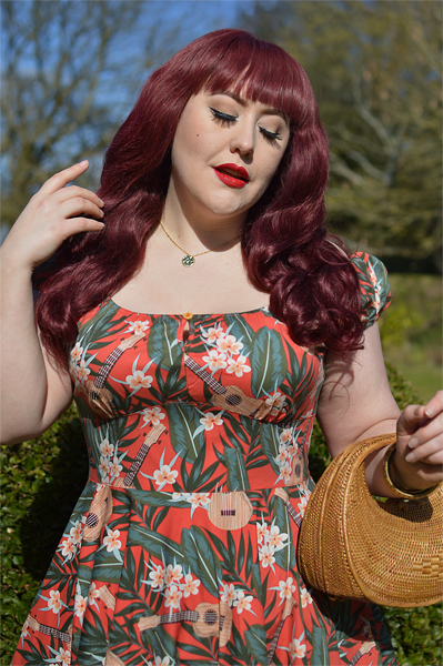 Plus size pinup Miss Amy May models the Ukulele 50s dress gifted by Hell Bunny for a fit and size review