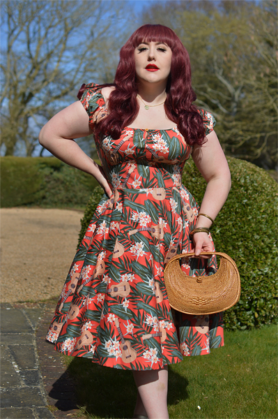 Plus size pinup Miss Amy May models the Ukulele 50s dress gifted by Hell Bunny for a fit and size review