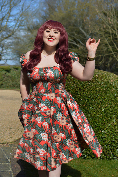 Plus size pinup Miss Amy May models the Ukulele 50s dress gifted by Hell Bunny for a fit and size review