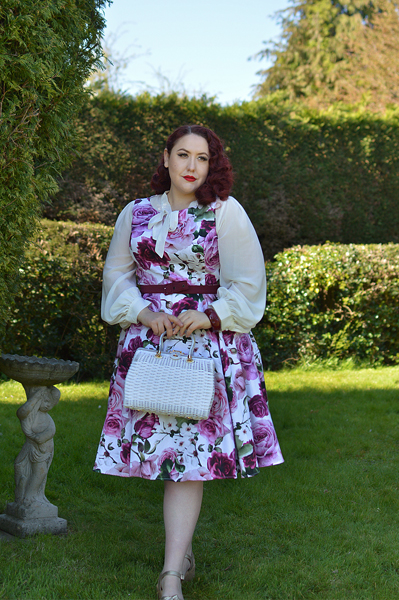 Plus size pinup Miss Amy May models the Alice Floral Swing dress gifted by Hearts and Roses London for a fit and size review