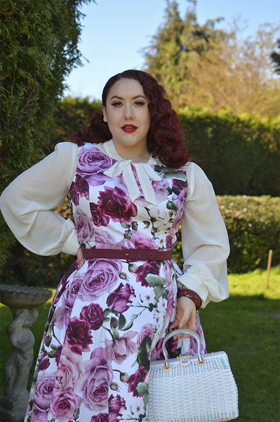 Plus size pinup Miss Amy May models the Alice Floral Swing dress gifted by Hearts and Roses London for a fit and size review