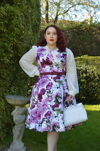 Plus size pinup Miss Amy May models the Alice Floral Swing dress gifted by Hearts and Roses London for a fit and size review