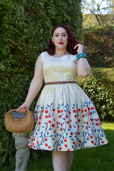 Plus size pinup Miss Amy May modelling the Candice Danube floral swing dress gifted by Collectif Clothing for a fit and size review
