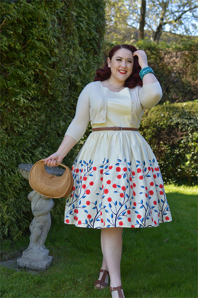 Plus size pinup Miss Amy May modelling the Candice Danube floral swing dress gifted by Collectif Clothing for a fit and size review