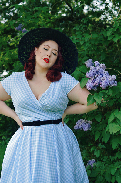 Plus size pinup Miss Amy May models the Hourglass White and Blue Gingham cotton Swing dress by The Pretty Dress Company for a fit and size review