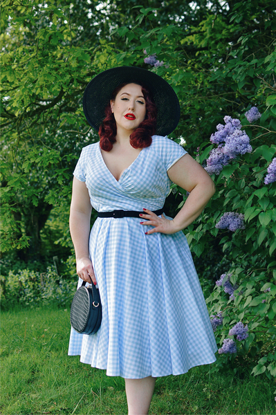 Plus size pinup Miss Amy May models the Hourglass White and Blue Gingham cotton Swing dress by The Pretty Dress Company for a fit and size review