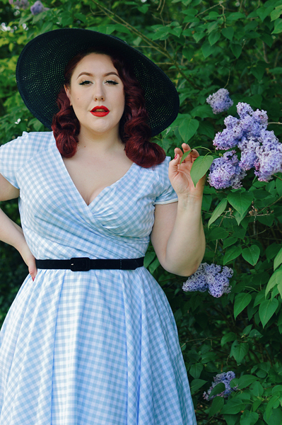 Plus size pinup Miss Amy May models the Hourglass White and Blue Gingham cotton Swing dress by The Pretty Dress Company for a fit and size review