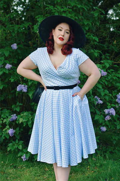 Plus size pinup Miss Amy May models the Hourglass White and Blue Gingham cotton Swing dress by The Pretty Dress Company for a fit and size review