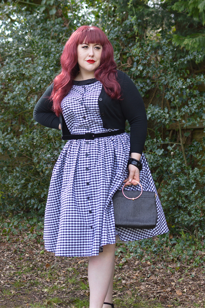 Plus size pinup Miss Amy May models the Black gingham Maxine dress by Unique Vintage for a fit and sizing review