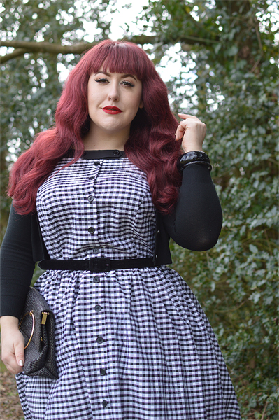 Plus size pinup Miss Amy May models the Black gingham Maxine dress by Unique Vintage for a fit and sizing review
