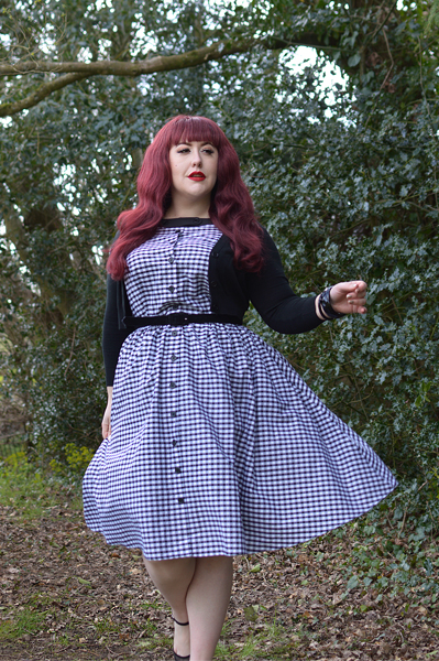 Plus size pinup Miss Amy May models the Black gingham Maxine dress by Unique Vintage for a fit and sizing review