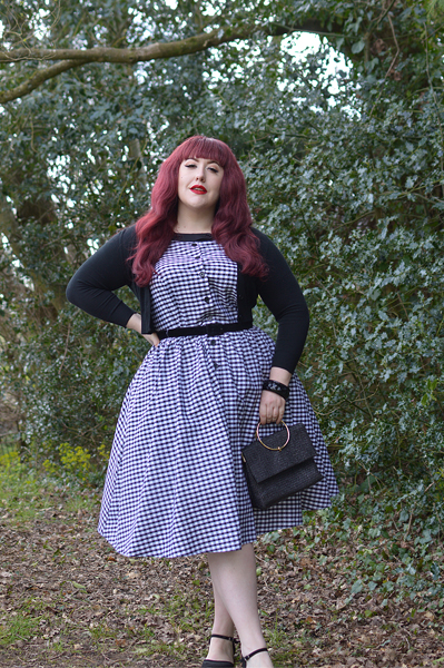 Plus size pinup Miss Amy May models the Black gingham Maxine dress by Unique Vintage for a fit and sizing review
