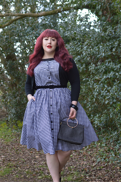 Plus size pinup Miss Amy May models the Black gingham Maxine dress by Unique Vintage for a fit and sizing review