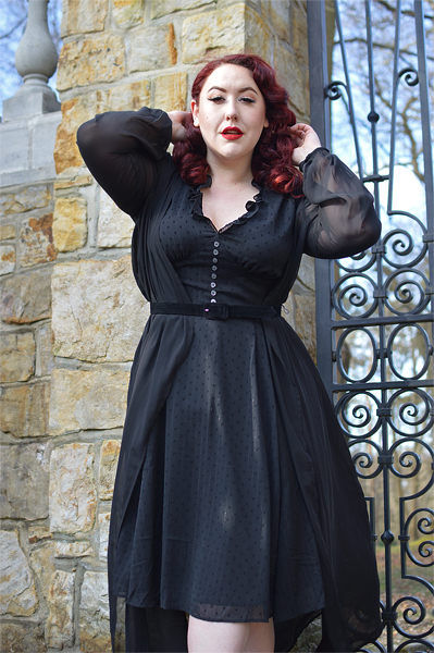 Plus size pinup Miss Amy May models the black Frilly Sundae dress gifted by Hell Bunny for a fit and size review