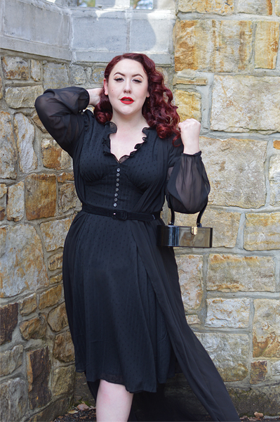 Plus size pinup Miss Amy May models the black Frilly Sundae dress gifted by Hell Bunny for a fit and size review
