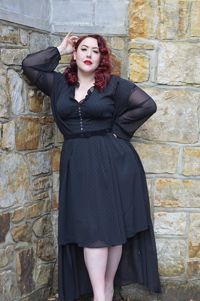 Plus size pinup Miss Amy May models the black Frilly Sundae dress gifted by Hell Bunny for a fit and size review