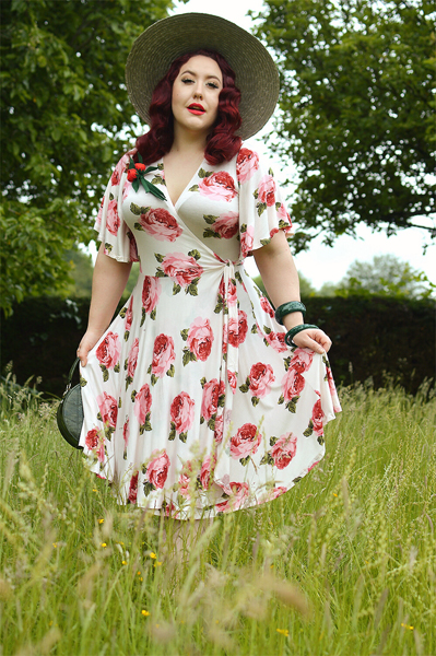 Plus size pinup Miss Amy May models the Rose Cream Aurora Dress gifted by Wax Poetic Clothing for a fit and size review