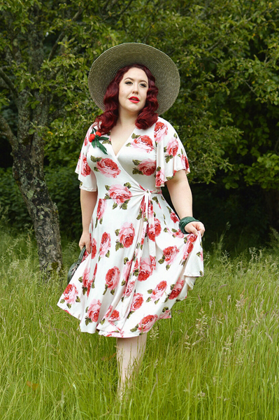 Plus size pinup Miss Amy May models the Rose Cream Aurora Dress gifted by Wax Poetic Clothing for a fit and size review