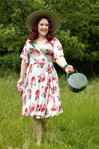 Plus size pinup Miss Amy May models the Rose Cream Aurora Dress gifted by Wax Poetic Clothing for a fit and size review