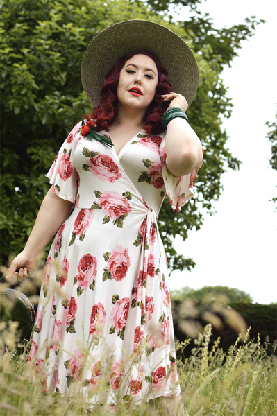 Plus size pinup Miss Amy May models the Rose Cream Aurora Dress gifted by Wax Poetic Clothing for a fit and size review