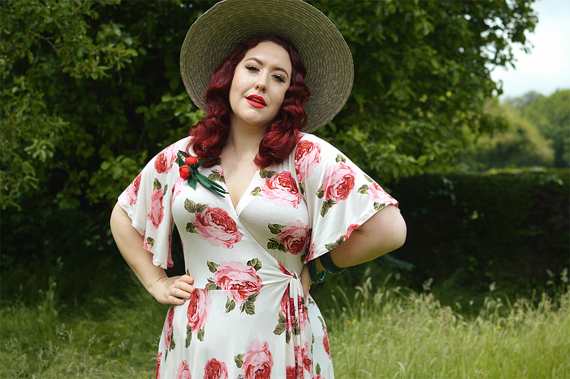 Plus size pinup Miss Amy May models the Rose Cream Aurora Dress gifted by Wax Poetic Clothing for a fit and size review