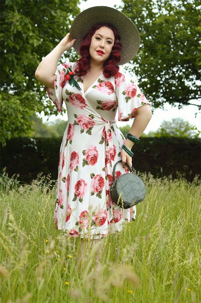 Plus size pinup Miss Amy May models the Rose Cream Aurora Dress gifted by Wax Poetic Clothing for a fit and size review