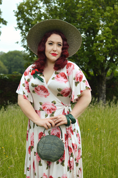 Plus size pinup Miss Amy May models the Rose Cream Aurora Dress gifted by Wax Poetic Clothing for a fit and size review