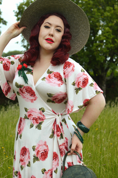 Plus size pinup Miss Amy May models the Rose Cream Aurora Dress gifted by Wax Poetic Clothing for a fit and size review