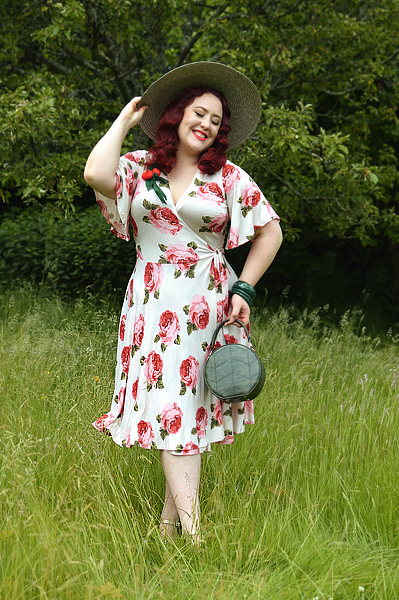 Plus size pinup Miss Amy May models the Rose Cream Aurora Dress gifted by Wax Poetic Clothing for a fit and size review