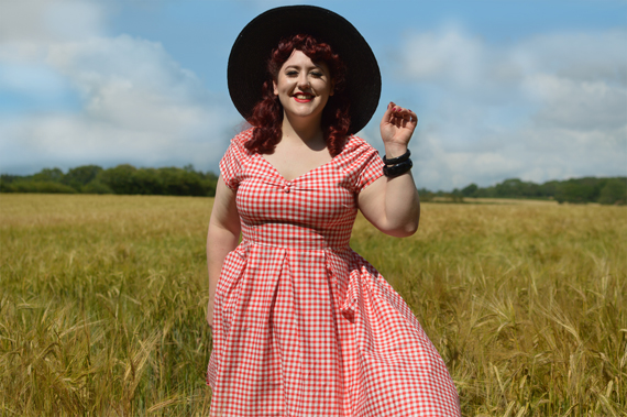 Plus size pinup Miss Amy May models the Red gingham off the shoulder Lily dress by Dolly & Dotty for a fit and size review
