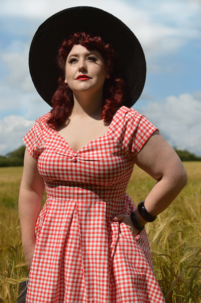 Plus size pinup Miss Amy May models the Red gingham off the shoulder Lily dress by Dolly & Dotty for a fit and size review