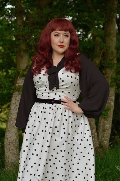 Plus size pinup Miss Amy May models the Polka Dot May crossover bust swing dress gifted by Dolly & Dotty for a fit and size review