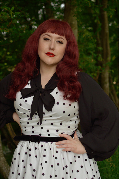 Plus size pinup Miss Amy May models the Polka Dot May crossover bust swing dress gifted by Dolly & Dotty for a fit and size review